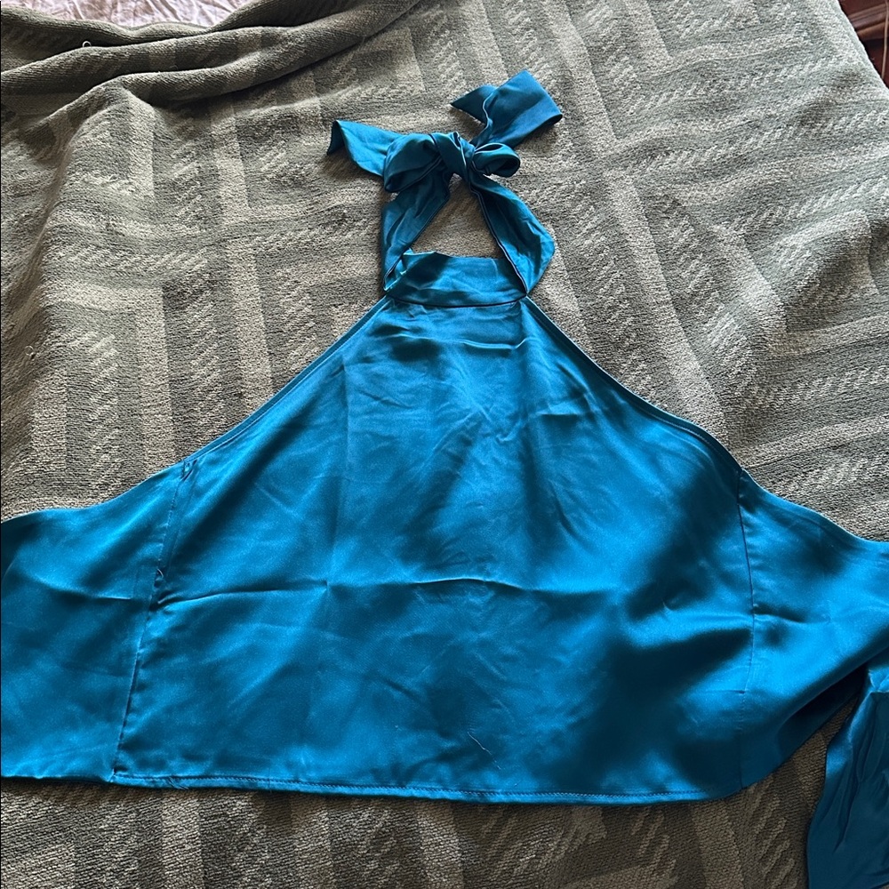 NWOT! Beautiful  wrap top. Toes at neck as well as behind back. medium